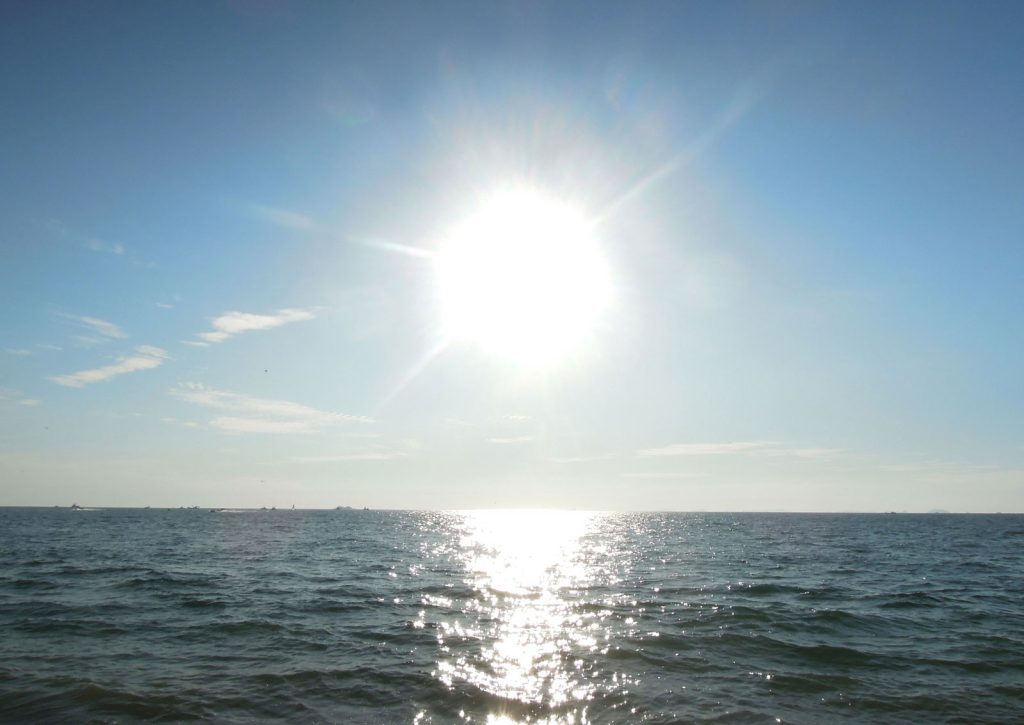 Ocean and sun symbolizing samadhi and unity consciousness